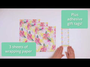 Opening a package of Wrappily Hibiscus Fan Palm Wrapping Paper.